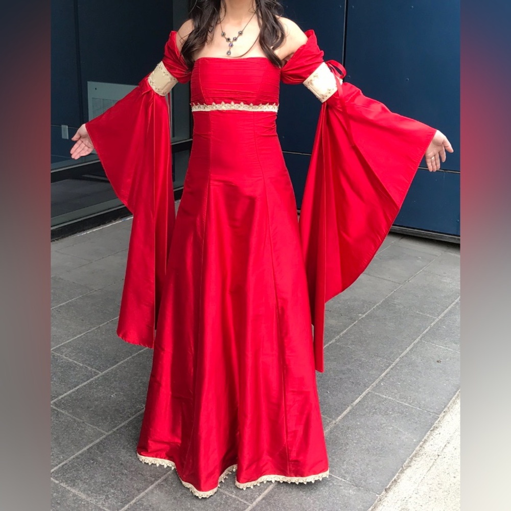 Elegant Red Gown with Dramatic Sleeves